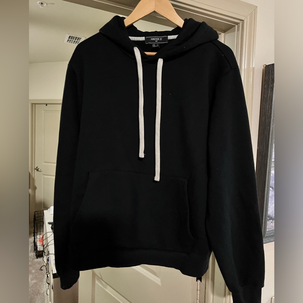 Black hoodie with white hood drawstrings